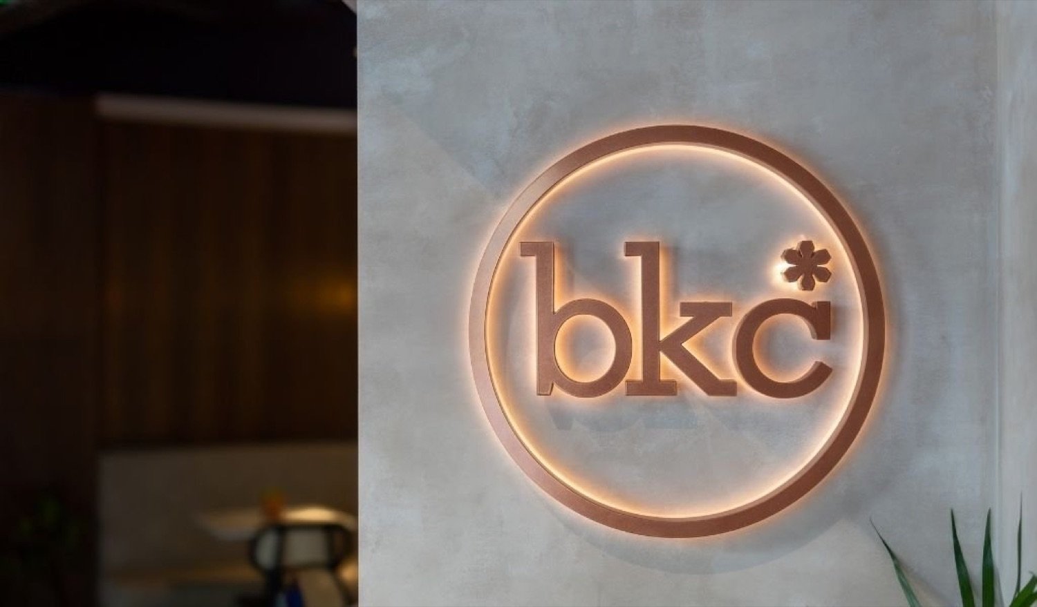 The BKC logo lit above the restaurant entrance